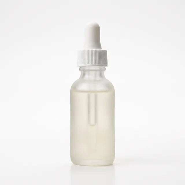 Frosted glass serum bottle on a white background
