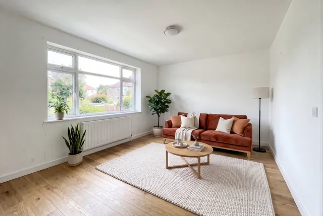 The staged room with a terracotta velvet sofa