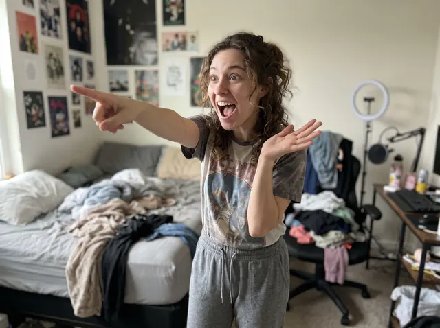 Content creator pointing with a surprised face, original photo