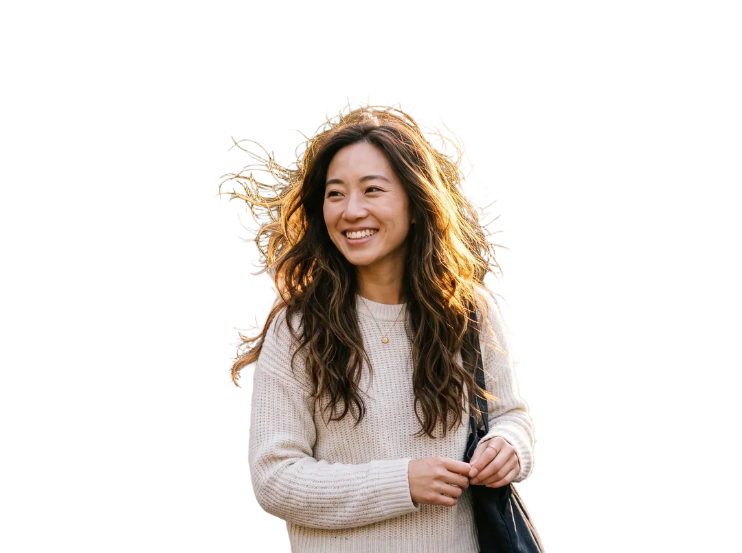 Woman with long windblown hair backlit by the sun, background removed (transparent PNG)