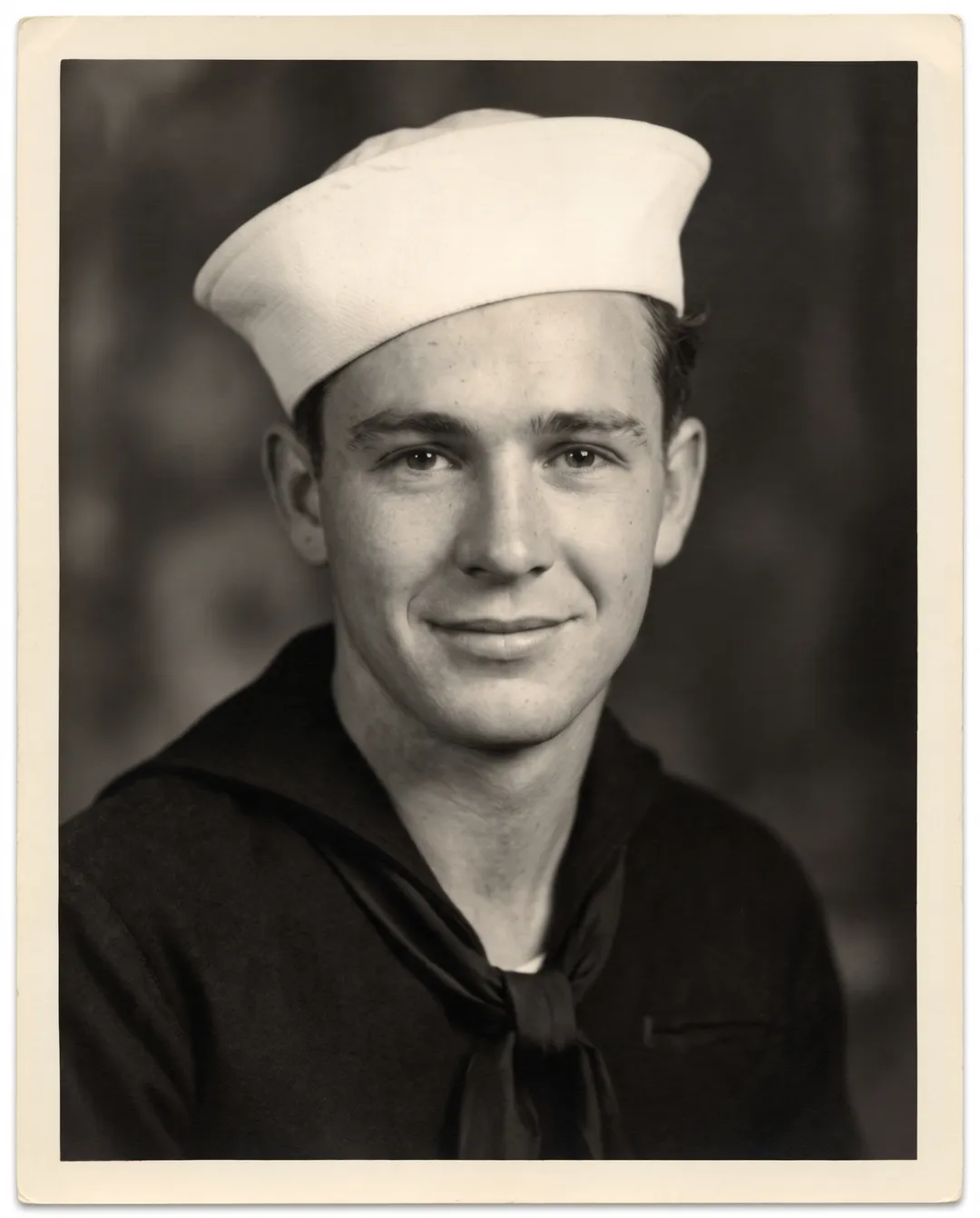 Restored photo of a 1940s portrait of a young sailor