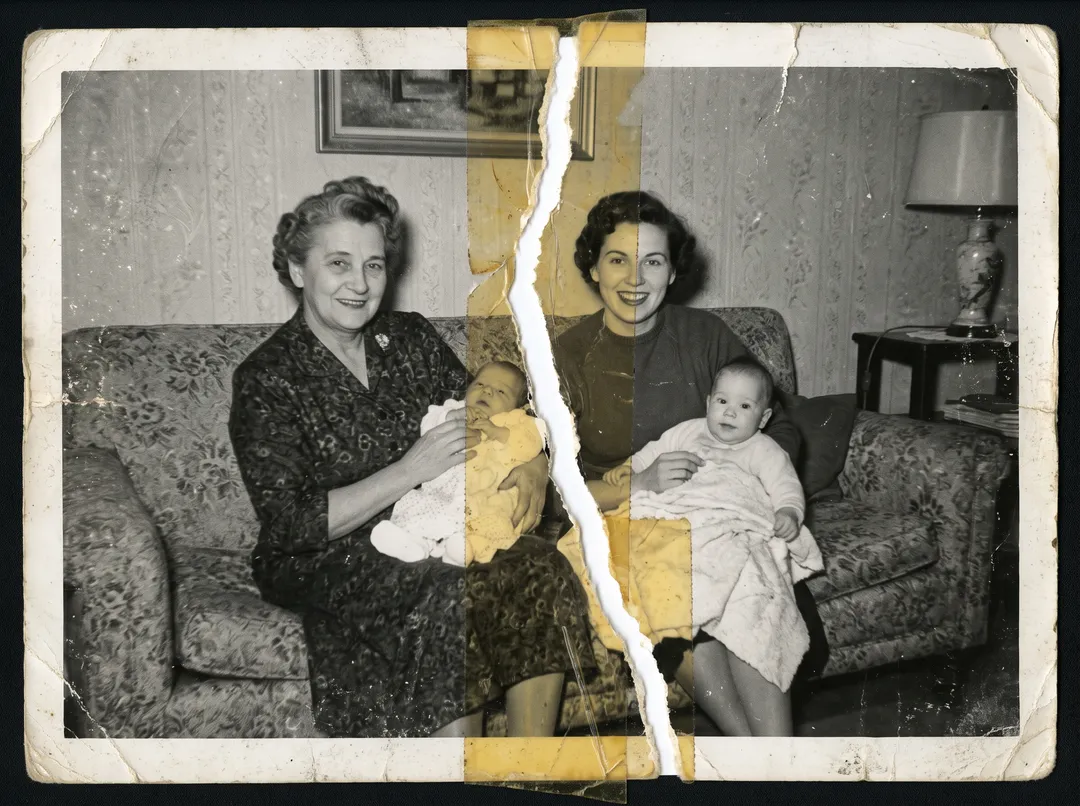 Damaged old photo of three generations of a 1950s family on a patterned sofa: torn in half and taped back together